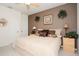 Comfortable bedroom featuring neutral tones, a ceiling fan, and cozy decor, creating a relaxing atmosphere at 7685 Plantation Cir # B, University Park, FL 34201