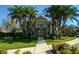 Beautiful two-story clubhouse with manicured landscaping and brick accents at 7685 Plantation Cir # B, University Park, FL 34201