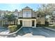 Inviting townhome with a neutral color scheme, well-manicured landscaping, and a convenient attached garage at 7685 Plantation Cir # B, University Park, FL 34201
