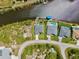 Overhead view of homes with pools and private docks along a scenic canal community at 8058 Santa Cruz Dr, Port Charlotte, FL 33981