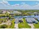 Aerial view of homes along a canal, showcasing a pool, boat dock and waterfront living at 8058 Santa Cruz Dr, Port Charlotte, FL 33981