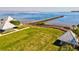 Expansive waterfront property with a long fishing pier, covered picnic areas, and lush green lawns at 8058 Santa Cruz Dr, Port Charlotte, FL 33981