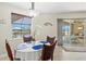 Bright dining area features views of the water and comfortable seating for four at 8058 Santa Cruz Dr, Port Charlotte, FL 33981