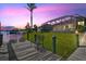 Picturesque waterfront view from a private dock, featuring a tranquil canal and lush greenery at 8058 Santa Cruz Dr, Port Charlotte, FL 33981