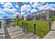 Dock and seating overlooking the water, with a view of a screened-in patio of a property at 8058 Santa Cruz Dr, Port Charlotte, FL 33981
