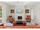 Inviting living room with a fireplace, comfortable seating, and easy access to outdoor living spaces at 8058 Santa Cruz Dr, Port Charlotte, FL 33981