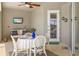 Enclosed patio space featuring a comfortable seating area and scenic waterfront view at 8058 Santa Cruz Dr, Port Charlotte, FL 33981