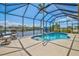 Inviting in-ground pool with waterfront view in screened enclosure at 8058 Santa Cruz Dr, Port Charlotte, FL 33981