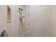 Modern shower with beige tiling, and updated shower head fixtures at 8058 Santa Cruz Dr, Port Charlotte, FL 33981