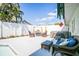 Backyard patio with comfortable seating, spa, privacy fence, and lush landscaping at 8208 17Th Nw Ave, Bradenton, FL 34209