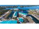 This aerial shot showcases the condo community, pool, and nearby waterways at 8222 Harborside Cir, Englewood, FL 34224