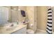 Bathroom featuring a vanity with a sink, toilet, and a shower with blue striped shower curtain at 8222 Harborside Cir, Englewood, FL 34224