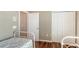 Bedroom featuring two twin beds and a closet with double doors and laminate wood flooring at 8222 Harborside Cir, Englewood, FL 34224