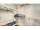 Walk-in closet with shelving and storage space for organization, with nice wood laminate flooring at 8222 Harborside Cir, Englewood, FL 34224