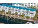 Exterior condo view shows building's architectural details and waterfront access at 8222 Harborside Cir, Englewood, FL 34224