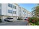 A view of the condo garages, entrances, and landscaping at 8222 Harborside Cir, Englewood, FL 34224