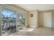 Sunroom with sliding glass doors opening to the backyard patio, with room for outdoor seating at 8222 Harborside Cir, Englewood, FL 34224