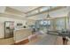 Open-concept living space includes a kitchen, dining area, and balcony access at 8222 Harborside Cir, Englewood, FL 34224
