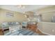Open living space with comfortable seating, a dining area, and a breakfast bar at 8222 Harborside Cir, Englewood, FL 34224
