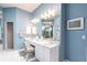 Bathroom featuring double sinks, a vanity, and large mirror provides ample space and lighting at 832 Carnoustie Dr, Venice, FL 34293
