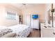 Bedroom featuring light vinyl wood floors, ceiling fan, and closet at 832 Carnoustie Dr, Venice, FL 34293