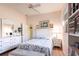 Bedroom featuring bright paint, light vinyl wood floors, and a window at 832 Carnoustie Dr, Venice, FL 34293