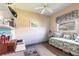 Bedroom featuring neutral tones, a twin bed, and a ceiling fan at 832 Carnoustie Dr, Venice, FL 34293