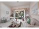Cozy living room featuring a decorative window treatment, a piano, and sliding glass doors at 832 Carnoustie Dr, Venice, FL 34293