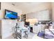 Comfortable home office featuring bright paint, built in storage, and luxury vinyl floors at 832 Carnoustie Dr, Venice, FL 34293
