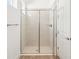 Modern bathroom with a glass-enclosed shower and tile walls at 8405 Golden Beach Ct, Parrish, FL 34219