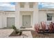 Inviting front entrance with double doors, well-maintained landscaping and stylish walkway at 8405 Golden Beach Ct, Parrish, FL 34219