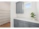 Walk-in pantry features gray cabinets, a white quartz countertop, and wire shelving at 8405 Golden Beach Ct, Parrish, FL 34219
