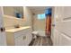 Bathroom featuring a shower/tub combo and a white vanity at 8731 Peggy Ave, Sarasota, FL 34231