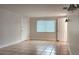 Bright bedroom with tile flooring, white walls, and natural light from a large window at 8731 Peggy Ave, Sarasota, FL 34231