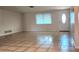 Spacious living room featuring tile flooring and a door with access to the front of the home at 8731 Peggy Ave, Sarasota, FL 34231