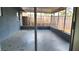 View of a screened-in porch looking out at a wooden fence at 8731 Peggy Ave, Sarasota, FL 34231