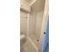 A standing shower and toilet with white tile walls at 8731 Peggy Ave, Sarasota, FL 34231