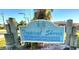 Vintage Tropical Shores sign featuring palm trees and nautical wave design at 8731 Peggy Ave, Sarasota, FL 34231