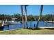 Waterfront property with a private dock, boat and clear blue water at 8731 Peggy Ave, Sarasota, FL 34231