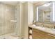 Elegant bathroom featuring a glass-enclosed shower, modern fixtures, and a vanity with ample storage at 915 Seaside Dr # 606 Weeks 6-7, Sarasota, FL 34242
