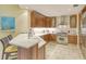 Gourmet kitchen features white countertops, stainless steel appliances, and modern, wooden cabinets at 915 Seaside Dr # 606 Weeks 6-7, Sarasota, FL 34242
