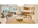Open-concept living area with tile floors, dining area, and kitchen access at 915 Seaside Dr # 606 Weeks 6-7, Sarasota, FL 34242