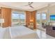 Bright main bedroom with a view, featuring a comfy chair and a large window at 915 Seaside Dr # 606 Weeks 6-7, Sarasota, FL 34242