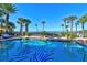 Sparkling pool with palm tree accents and ocean views at 915 Seaside Dr # 606 Weeks 6-7, Sarasota, FL 34242