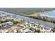 Stunning aerial view of a waterfront community with boating canals and single-Gathering homes at 10616 Ayear Rd, Port Charlotte, FL 33981