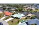 Waterfront home with canal access, showcasing a pool, tiki hut, and well-maintained landscaping at 10616 Ayear Rd, Port Charlotte, FL 33981