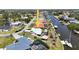 Waterfront property showing yard with boat, pool, tiki hut, dock, and canal access at 10616 Ayear Rd, Port Charlotte, FL 33981