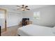 Bedroom with tiled floor, large closet, desk and shuttered window providing plenty of natural light at 10616 Ayear Rd, Port Charlotte, FL 33981