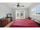 Bedroom with backyard view and ceiling fan at 10616 Ayear Rd, Port Charlotte, FL 33981