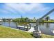 Waterfront property with private dock and boat lift, ideal for boating enthusiasts at 10616 Ayear Rd, Port Charlotte, FL 33981